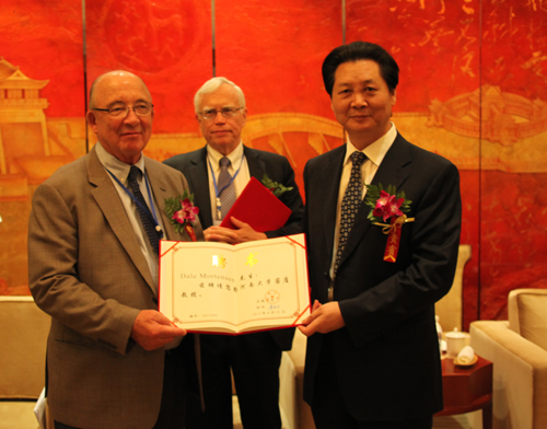 Host University President Lou Yuangong (right)  Keynote Speakers J. Heckman (middle) & D. Mortensen (left)